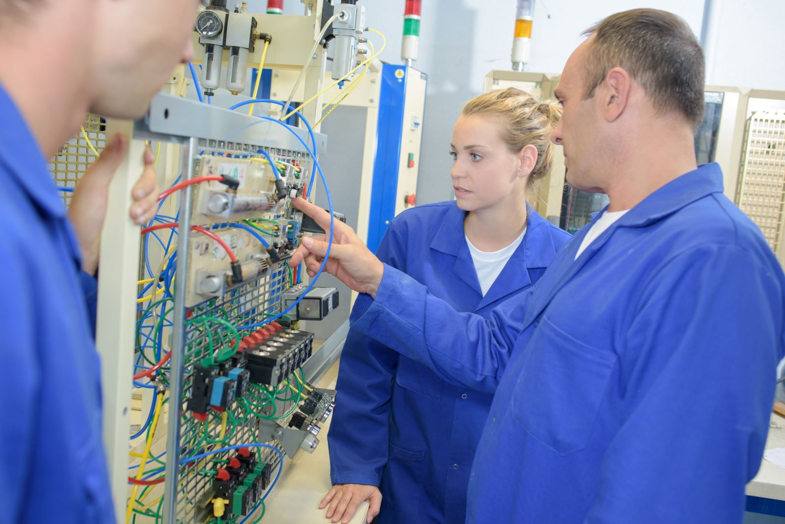 Employees looking at equipment